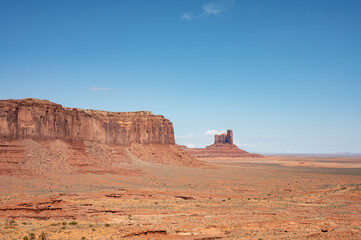 Fototapeta na wymiar Nice desert landscape with rocky Monument Valley. It's a sunny summer day with blue sky