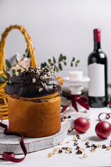 Easter cakes with colored eggs on a wooden table