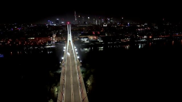 Drone view of the Metropolis Building at night and a street with heavy traffic. Crossroad Night capital of Warsaw Europe Poland