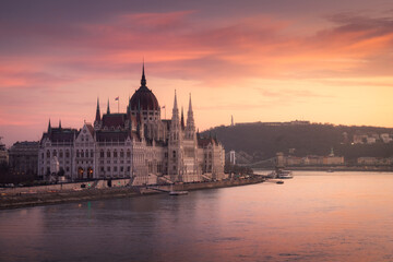 Evening view of Parliament, Chain Bridge and Buda Castle. Colorful sanset in Budapest, Hungary, Europe.
