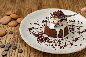 Tasting of chocolate fondant in restaurant.