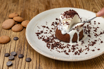 Tasting of chocolate fondant in restaurant.