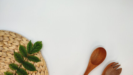 kitchen equipment concept with
wooden spoon and fork isolated on white background,