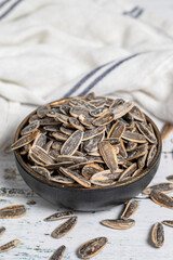 Sunflower seeds on wood background. Salted sunflower seeds. Healthy food. close up