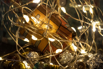 christmas lights and giftbox shining close up 