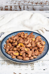 Cashew nuts on wood background. Raw cashews. Healthy food. close up