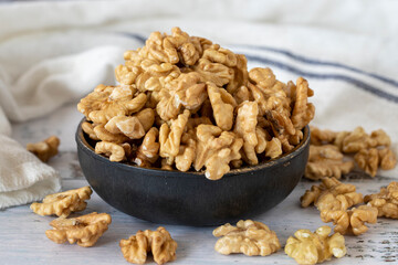 Walnut kernel on wood floor. Nuts. Healthy food. close up