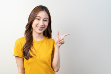 Asian young woman pointing finger show service to customer