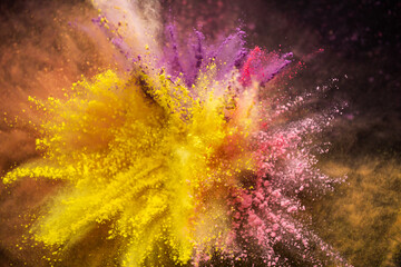 Colored powder explosion isolated on black background