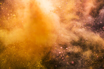 Colored powder explosion isolated on black background