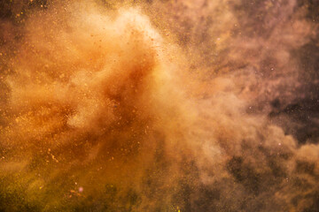 Colored powder explosion isolated on black background