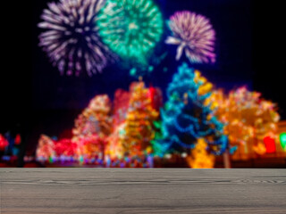 The empty table wooden board in front of the background is blurred. Brown wood perspective in new year's celebration firecrackers -can be used to display or montage your products. Mock up for product 