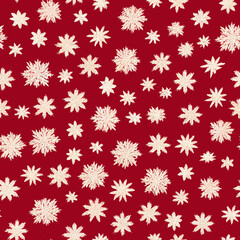 A seamless repeatable pattern of snowflakes.