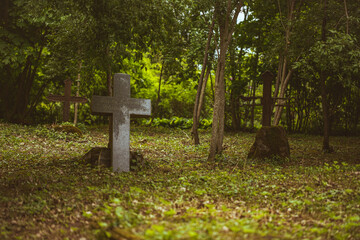  abandoned grave place with headstone remains in Latvia forest cemetery. Old quiet burial ground
