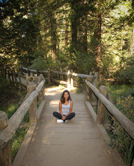 Sitting woman on the bridgewalk