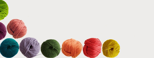 Balls of wool colored yarn for hand knitting and crochet on white background. Mock up, flat lay, copy space, banner