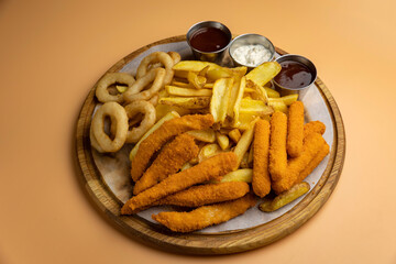 delicious snacks in the restaurant. on an orange background
