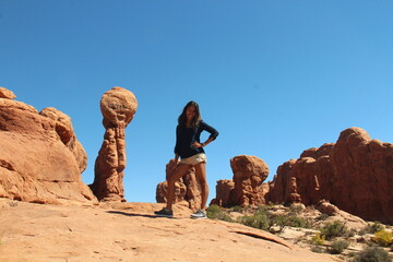 Fototapeta na wymiar Woman and sandstone monoliths, Zion National Park, Utah