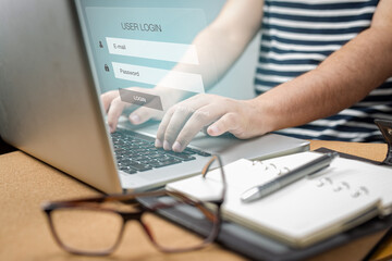 Man using kyeboard computer laptop login interface on touch screen user name and password inputs