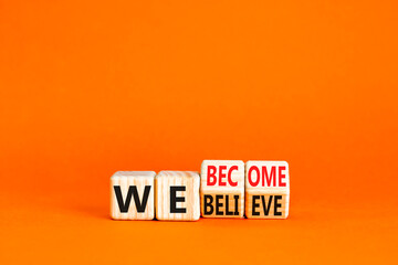 We become or believe symbol. Concept word We believe We become on wooden cubes. Beautiful orange table orange background. Business we become or believe concept. Copy space.