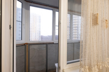 glazed balcony in a modern apartment, economy option