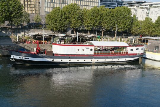 Nix Nox boat on the dock of the Seine near the library Francois Mitterand in Paris, France