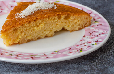 Delicious turkish pastry with syrup revani over a white plate