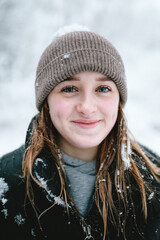 Portrait of a woman in winter with snow in her hair