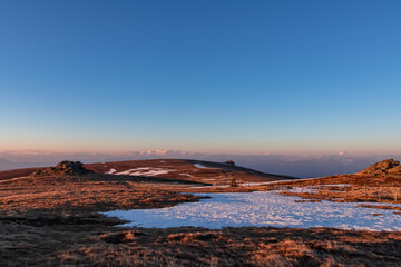 Scenic morning view after sunrise on summit cross of mountain peaks Grosser Sauofen and Zingerle Kreuz, Saualpe, Lavanttal Alps, Carinthia, Austria, Europe. Hiking trail Wolfsberg. Karawanks mountains