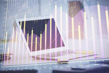 Forex graph hologram on table with computer background. Multi exposure. Concept of financial markets.