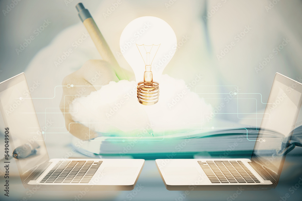 Poster bulb hologram over hands taking notes background. concept of idea. double exposure