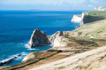 Beautiful views of nature on way to Durdle door in Lulworth, Dorset, United Kingdom. Part of Jurassic Coast World Heritage Site, view of stone formations and sea, selective focus