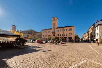 Obraz premium Boves, Cuneo, Italy - November 22, 2022: piazza Italia with Town hall building with the tower seen from via Trieste