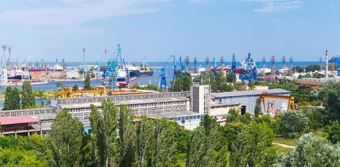Port cranes and industrial buildings, summer view of Varna harbor