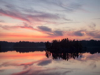 sunset over a forest lake