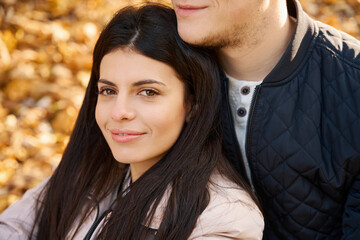 Charming young woman in the arms of her friend