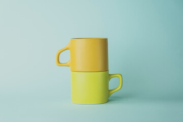 cup for tea or coffee. colored cups on a light background