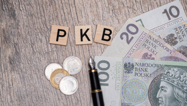 Inscription PKB which is Gross Domestic product in Polish next to polish zloty. Concept showing economic growth in Poland