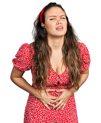 Young hispanic girl wearing casual clothes with hand on stomach because nausea, painful disease feeling unwell. ache concept.