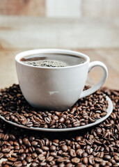 cup of coffee with beans