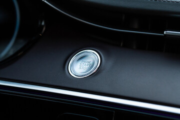 Obraz na płótnie Canvas Engine start button. Close up engine car start stop button. Modern car interior details.