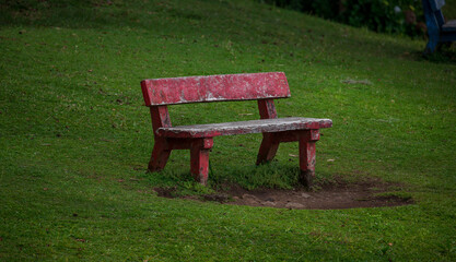 old red bench in the park