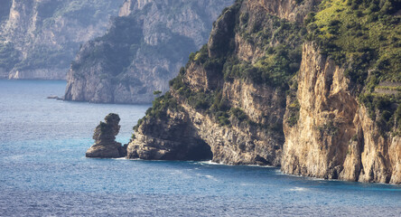 Fototapeta na wymiar Rocky Cliffs and Mountain Landscape by the Tyrrhenian Sea. Amalfi Coast, Italy. Nature Background.