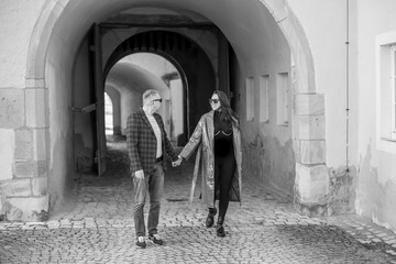 love story of a loving couple.a couple - a girl and a guy walk and hug near the arch