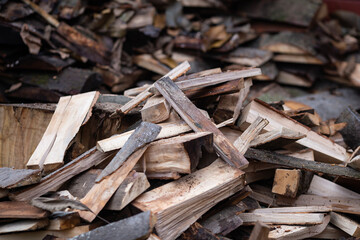 Big pile of firewood logs chopped for heating season 