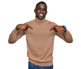 Young african american man wearing casual winter sweater looking confident with smile on face, pointing oneself with fingers proud and happy.