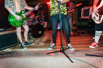 Band performing music in studio during rehearsal