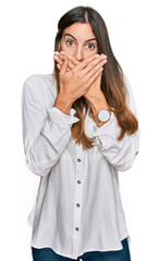 Young beautiful woman wearing casual clothes shocked covering mouth with hands for mistake. secret concept.