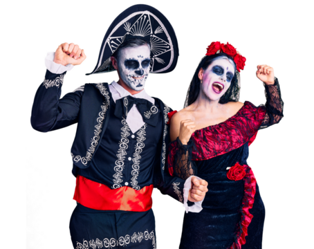 Young couple wearing mexican day of the dead costume over background dancing happy and cheerful, smiling moving casual and confident listening to music