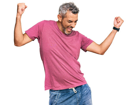 Middle age grey-haired man wearing casual clothes dancing happy and cheerful, smiling moving casual and confident listening to music - Powered by Adobe